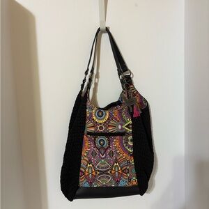 Sakroots bag, characterized by its distinctive bohemian and colorful design.